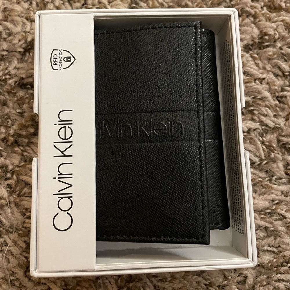 Calvin Klein men’s wallet. Never used. Still in packaging.